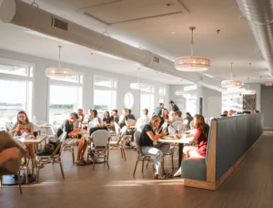 Where to eat before Movies in the Park Soundside - Marina Joe's dining area with waterfront views and booth seating