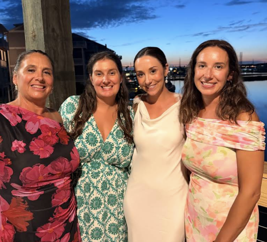 Four guests celebrating together on Marina Joe’s waterfront deck